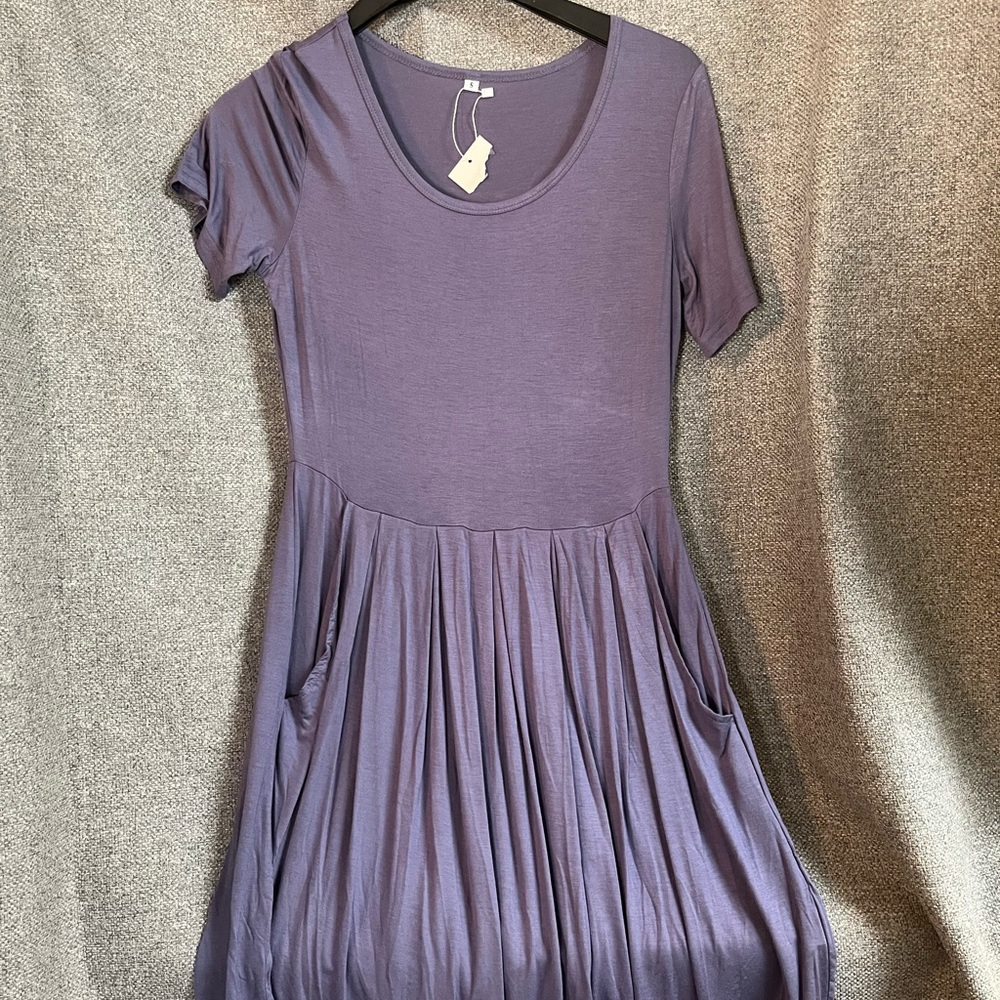 Fun shirt dress with pockets!! Jersey material and never worn